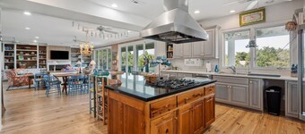 This vibrant family home features 8 bedrooms, and 8 bathrooms, ocean and creek views