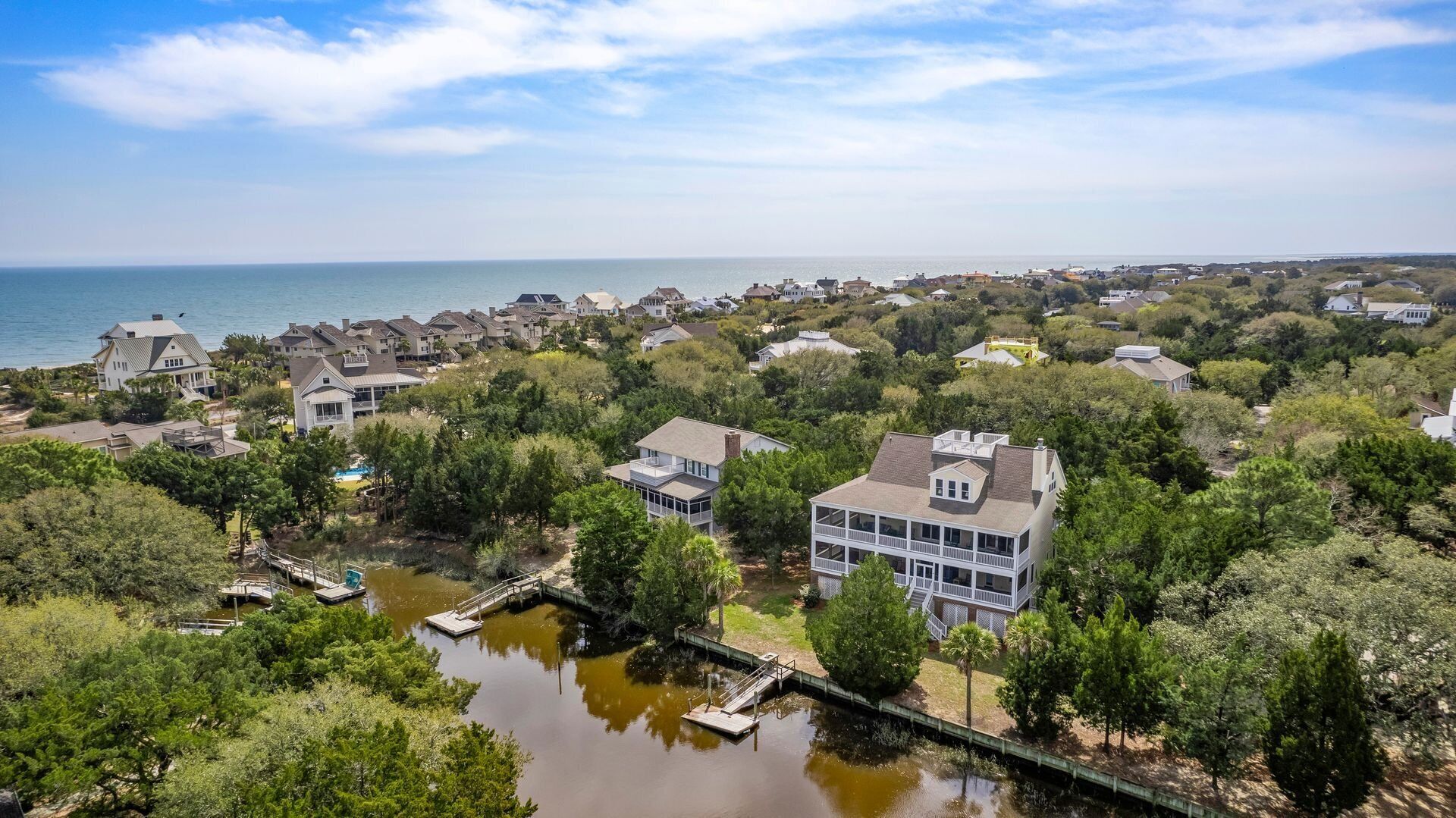 This vibrant family home features 8 bedrooms, and 8 bathrooms, ocean and creek views
