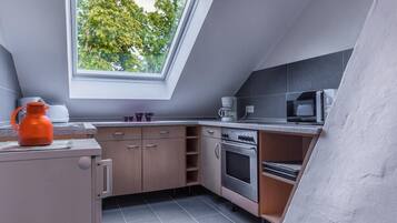 Fridge, microwave, stovetop, coffee/tea maker