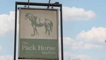 A sign for The Pack Horse Hayfield.