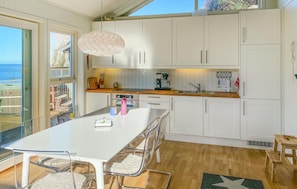 Fridge, stovetop, dishwasher, coffee/tea maker