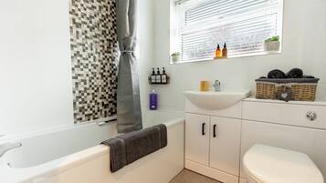 Shower, hair dryer, towels, shampoo
