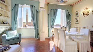 Deluxe Apartment, City View | Living area | 24-inch flat-screen TV with digital channels, TV