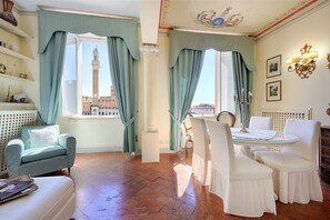 Deluxe Apartment, City View | Living area | 24-inch flat-screen TV with digital channels, TV - Palazzo Lenzi (Siena)