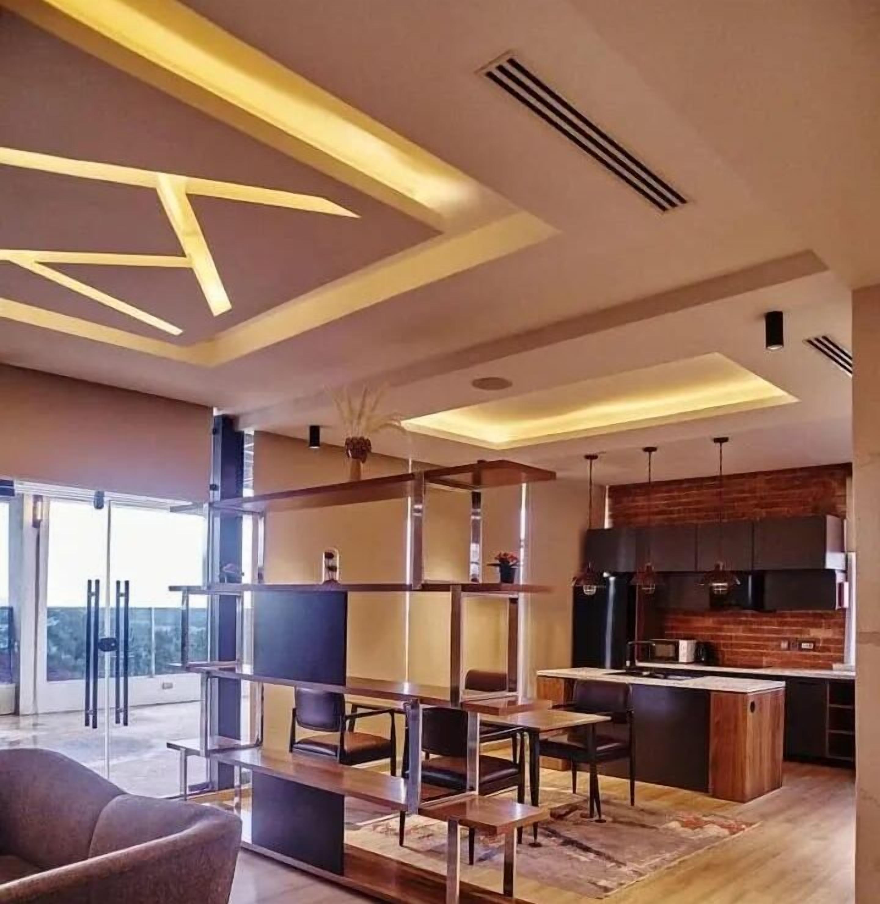 Presidential Apartment | Living area | 65-inch Smart TV with cable channels, Netflix, streaming services