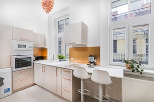 Deluxe Apartment, Courtyard View | Private kitchen | Full-size fridge, microwave, oven, stovetop
