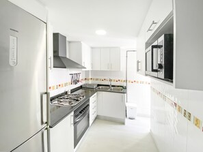 Family Apartment | Private kitchen | Full-size fridge, microwave, oven, stovetop