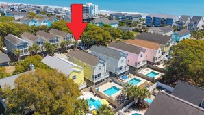 A residential area with houses, a swimming pool, and a view of the ocean. - Walk to the Beach 5 BR Beach House with a Private Pool! Catching R.A.E.S (Surfside Beach)