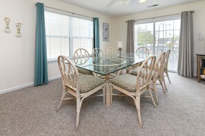 Enjoy meals in this cozy dining area with a glass-top table and six comfortable chairs.