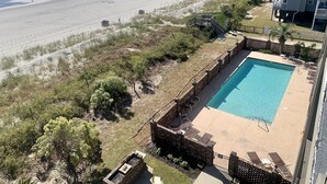 A beachfront property with a swimming pool, beach access, and a view of the ocean. - Oceanfront 2 BR Condo with a Shared Pool! Sea Shadow 402   (Surfside Beach)