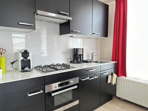 Fridge, microwave, stovetop, coffee/tea maker