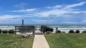 A coastal walkway leading to a wooden structure with a view of the ocean. - Direct Oceanview Premium Flat with 2 Bed/2 Bath +Murphy Bed. Just Renovated! (St. Augustine)