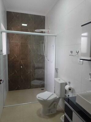 Shower, towels, soap, toilet paper