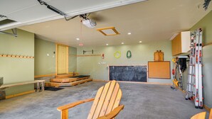 A spacious room with a wooden chair, a chalkboard, and a chalkboard eraser. - Remote Mountainside Cabin By Stillwater River (Nye)