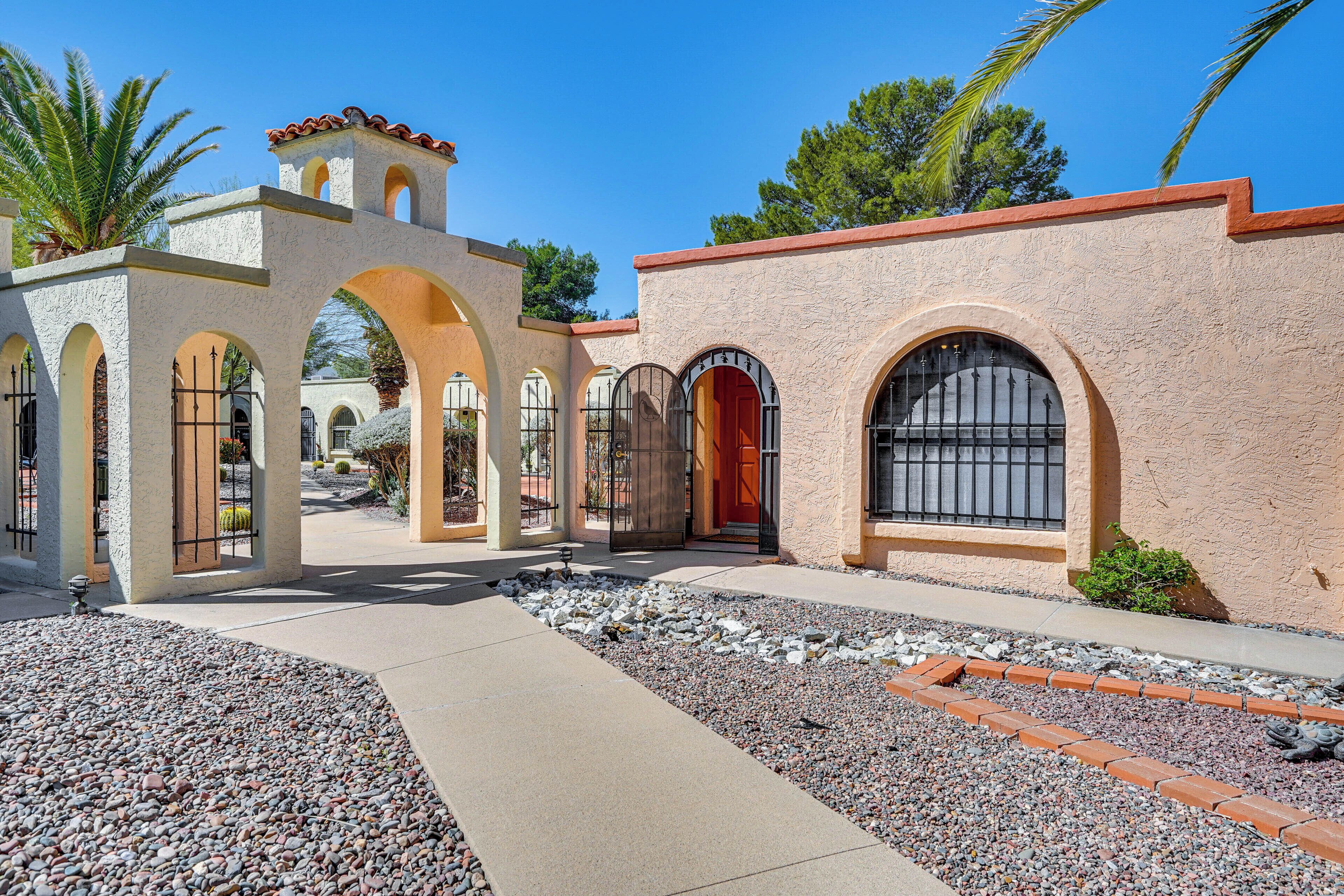 A building with arched doorways and a stone facade.