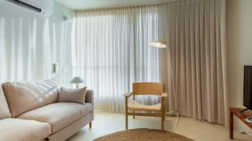 Standard Apartment | Living area | 40-inch flat-screen TV with cable channels