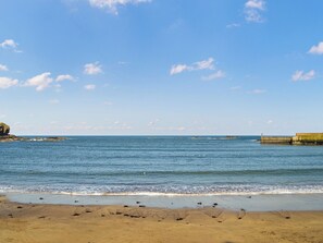 A beach with clear skies and calm waters.