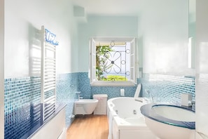 Hair dryer, bidet, towels, toilet paper