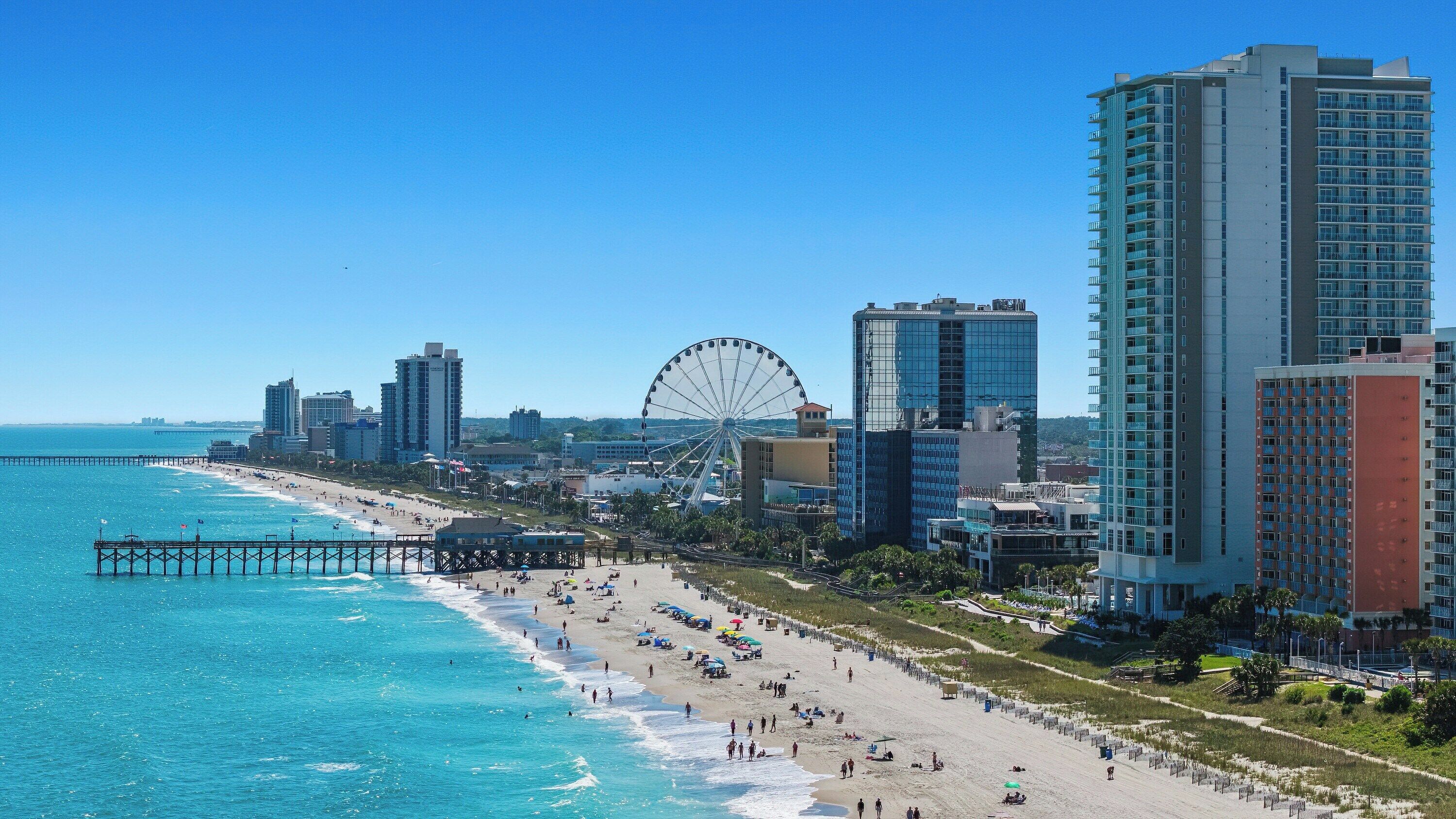 Beach nearby, white sand, beach towels