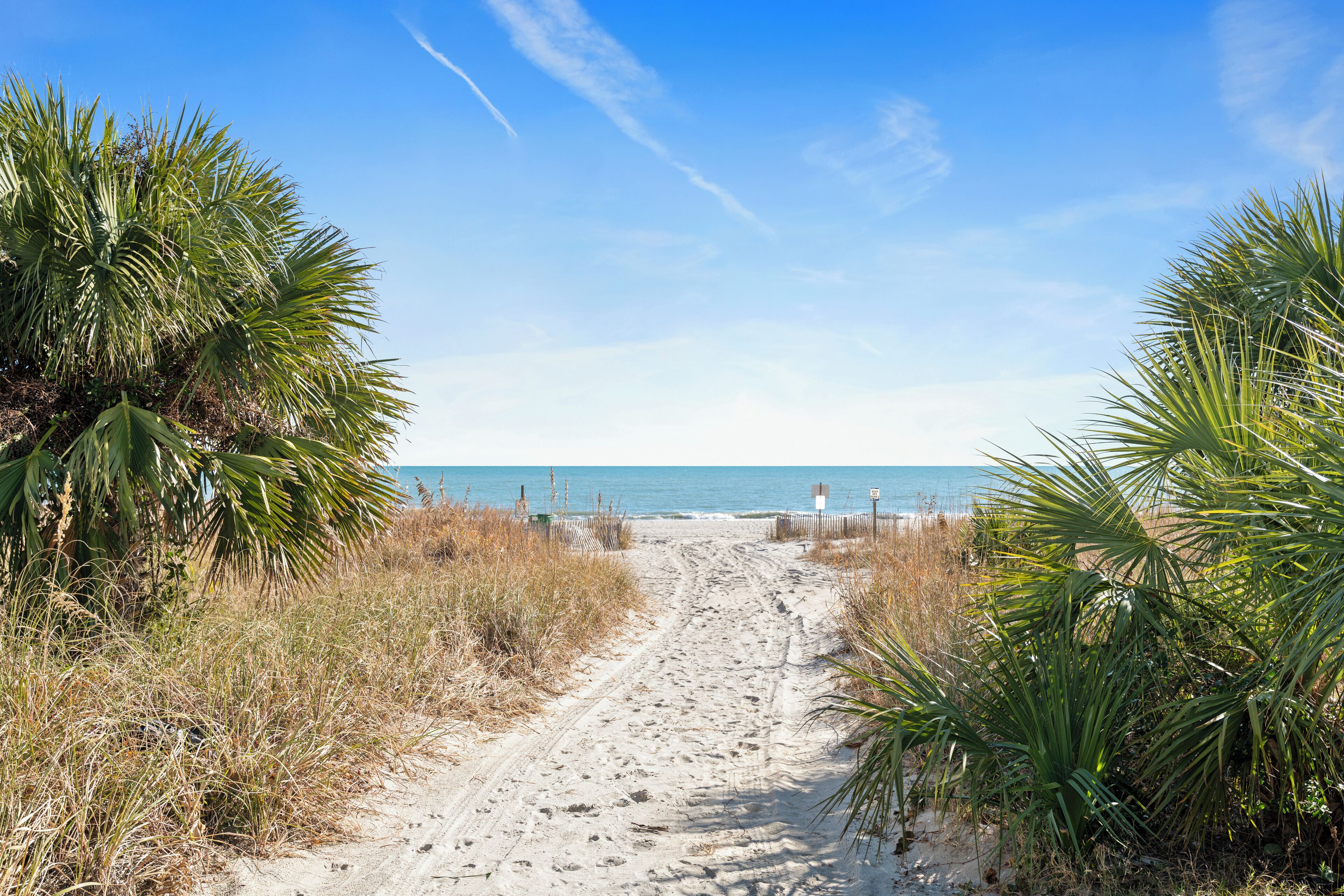 Beach nearby, white sand, beach towels