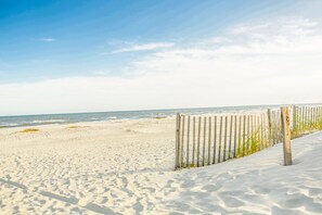 A sandy beach with a wooden fence and ocean view. - Cozy King Size Bed ! FREE BIKES, Poolside Villa with 3rd Floor Ocean View  (Hilton Head Island)