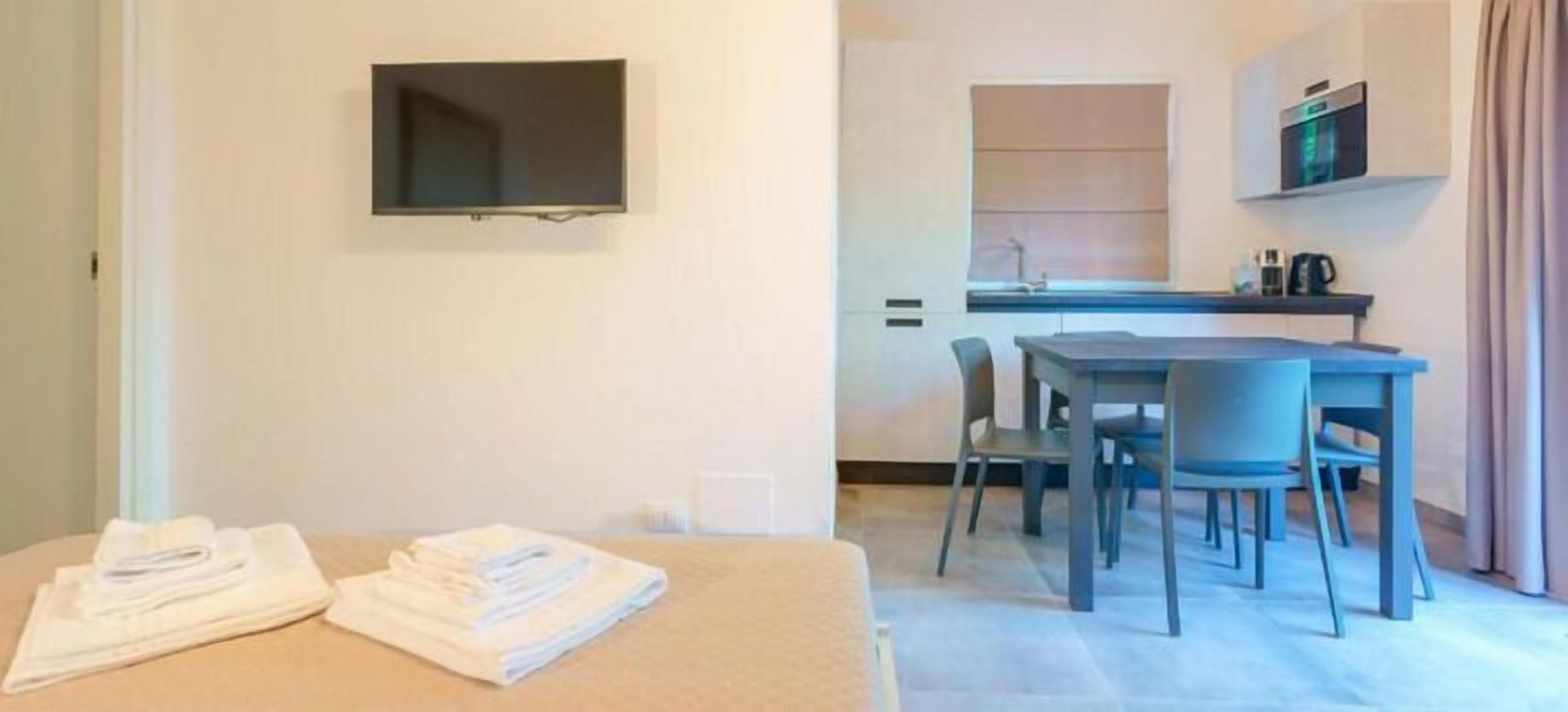Comfort Apartment | Living area | 55-inch Smart TV with digital channels