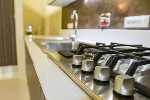 Superior Apartment, Courtyard Area | Private kitchen | Full-sized fridge, microwave, oven, stovetop - LuxRent Apartment Castello (Turin)