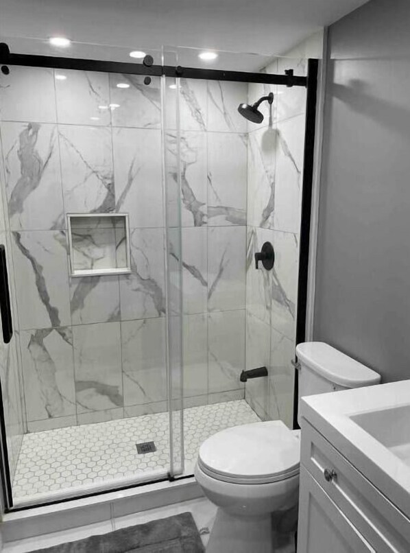 Shower, hair dryer, towels, soap
