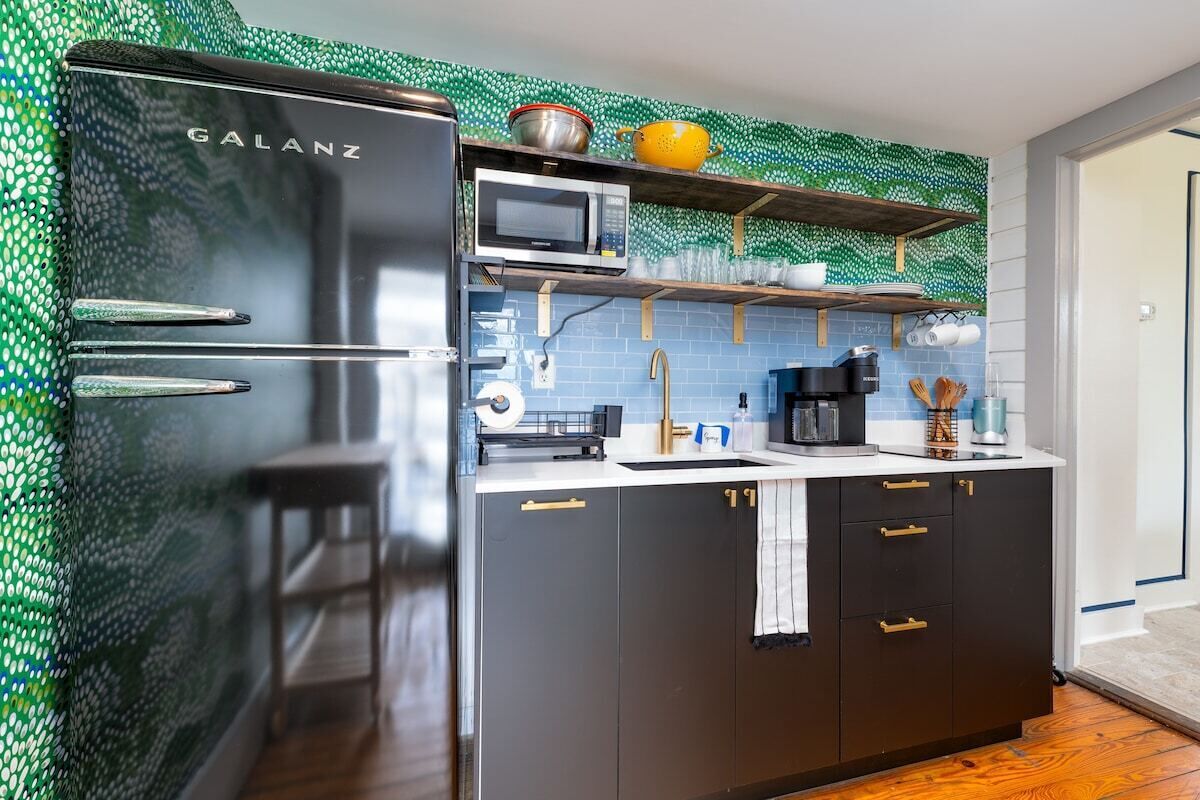 Fridge, microwave, coffee/tea maker, cookware/dishes/utensils