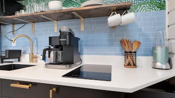 Fridge, microwave, coffee/tea maker, cookware/dishes/utensils