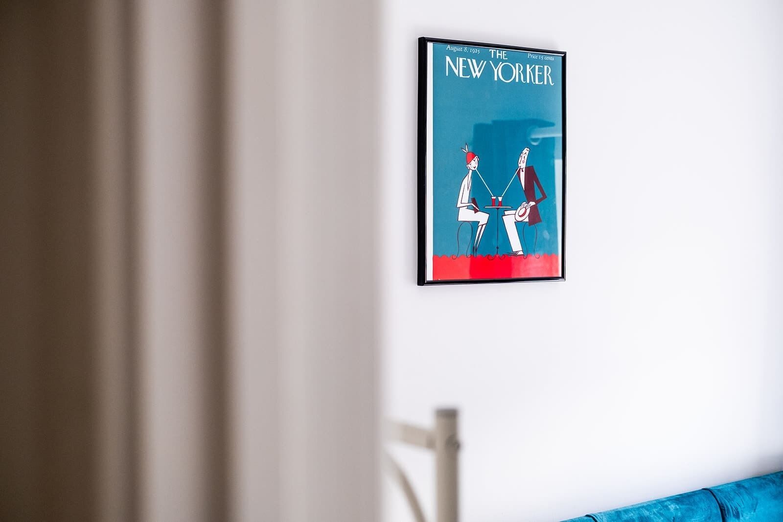 A framed New York Times magazine on a white wall.