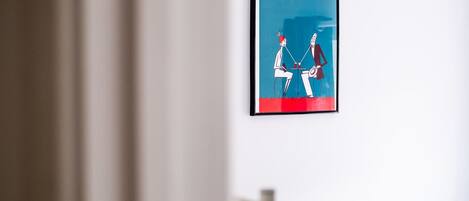 A framed New York Times magazine on a white wall.