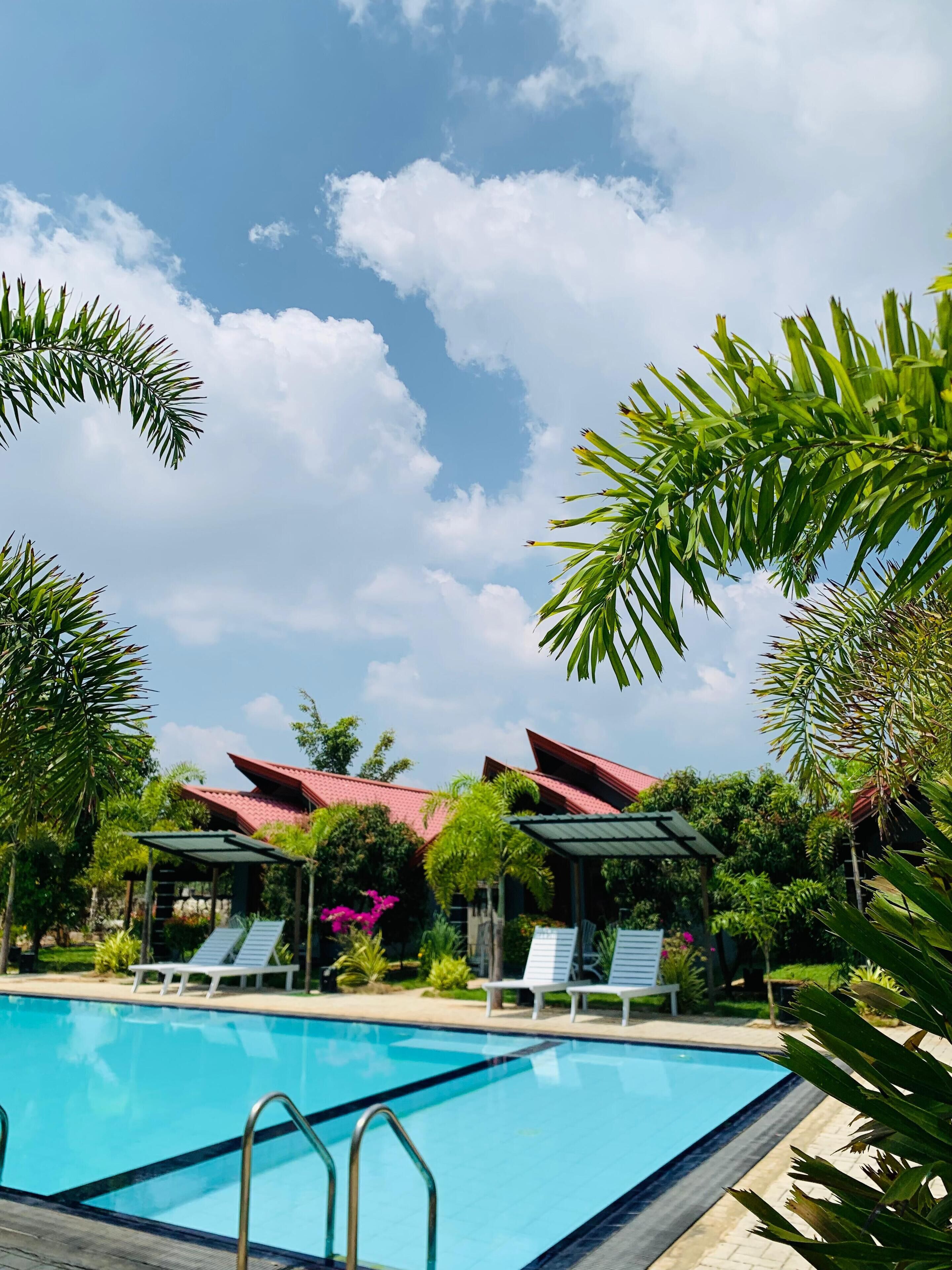 Outdoor pool, open 9:00 AM to 10:00 PM, pool umbrellas