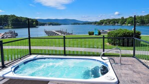 A hot tub with a view of a lake and dock. - Lakefront Condo w/ Free Resort Amenities at SML! (Huddleston)