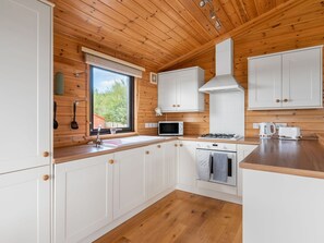 Microwave, oven, dishwasher, dining tables