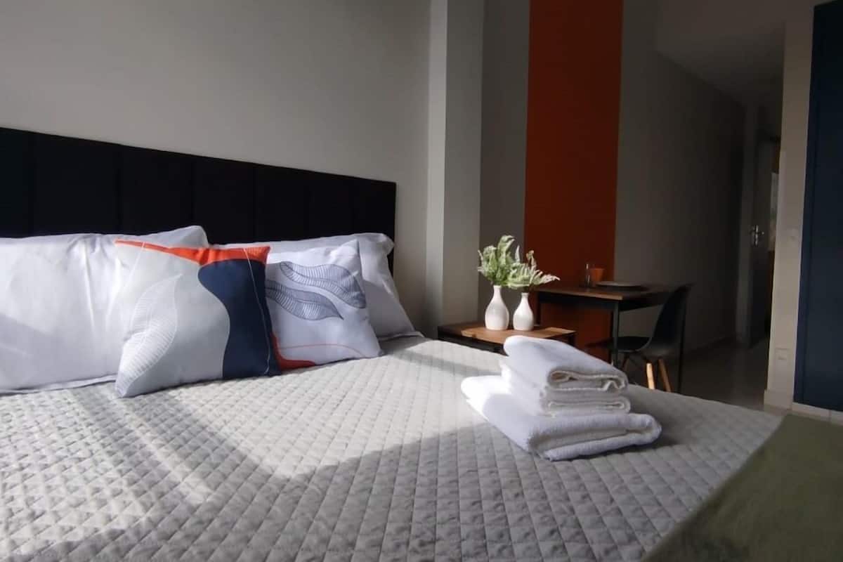 Desk, laptop workspace, free WiFi, bed sheets