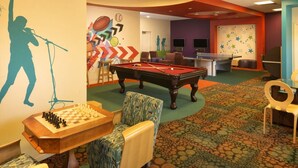 A recreational room with a pool table, a chess table, and a billiards table. - Orlando | Easy Disney Retreat | Pool + Parks (Orlando)