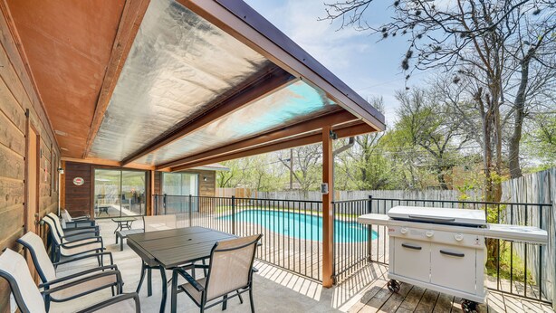 A covered outdoor patio with a pool, barbecue grill, and seating area. - Pet-Friendly San Antonio Vacation Rental w/ Pool! (San Antonio)