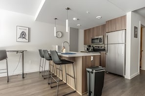 Coffee/tea maker, fridge, microwave, oven - 1BR+Den | Gym | Bellevue | Sophari Downtown D (Bellevue)
