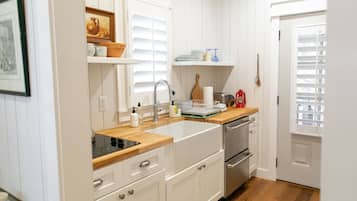 Fridge, coffee/tea maker, cookware/dishes/utensils