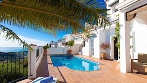 A rooftop pool area with lounge chairs, a sunbed, and a view of the sea. - Stunning private villa for 8 people with A/C, private pool, WIFI, TV and terrace (Frigiliana)