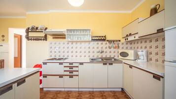Microwave, oven, dining tables