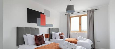 2 dormitorios, tabla de planchar con plancha, cuna de viaje y wifi