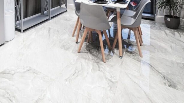 A modern kitchen with a dining area, marble flooring, and a large window. - Hackney Suites - Triple En-suite Room (G1) (Greater London)
