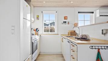 Fridge, stovetop, dishwasher, coffee/tea maker