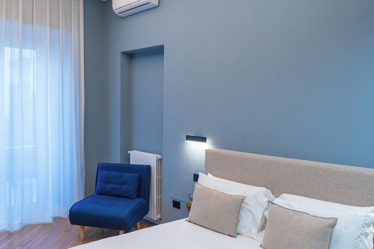 Suite Quadrupla con balcone | خزنة داخل الغرفة ومكتب وتجهيزات عازلة للصوت ومكواة/لوح كي