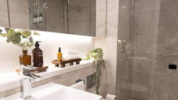 Hair dryer, towels, soap, shampoo