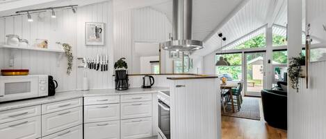 Fridge, stovetop, dishwasher, coffee/tea maker