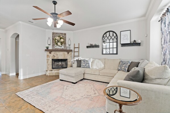 Smart TV, fireplace, books, computer monitors