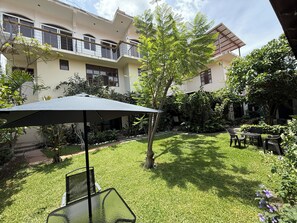 Deluxe Room, Garden View | Terrace/patio